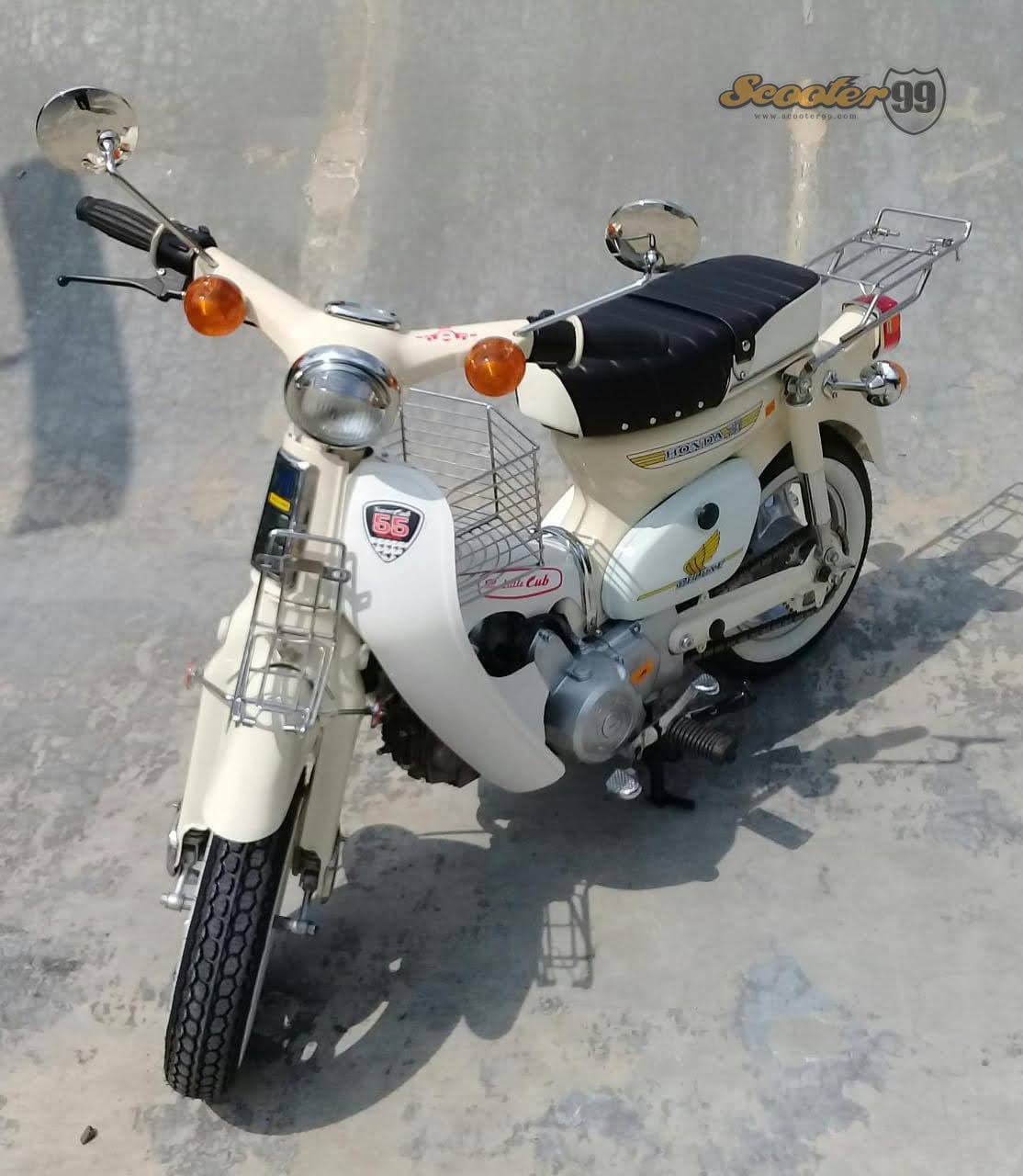 Rear view Honda C86 Mini Bike Cream with chrome rack